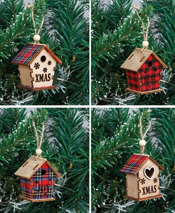 Detail of wooden Christmas birdhouse ornaments with red blue plaid and festive cutouts