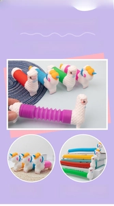 Length comparison of colorful pop tube unicorn toy showing retracted and extended sizes