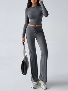 Slim fit dark grey long sleeve top and high-waisted flare trousers with drawstring