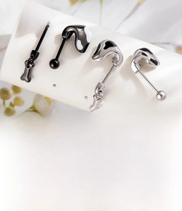 Detail of 0.8mm titanium steel bone-shaped cartilage studs in silver and black finish