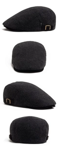 Detail view of herringbone flat cap featuring side metal adjustment buckle and classic texture