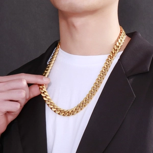 Close-up of 13mm gold Cuban link chain necklace for men with interlocking metal links