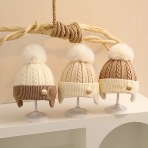 Winter baby cable knit beanies with fluffy pom-poms and ear protection flaps