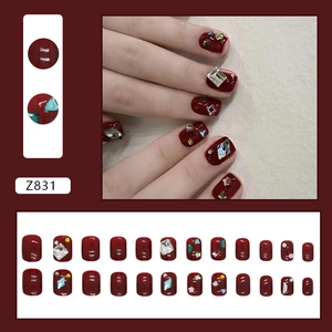 Sparkly wine red press-on nails with luxury rhinestones and heart star accents