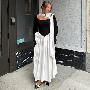 Detail of color-block long sleeve dress with matching scarf in elegant black and white