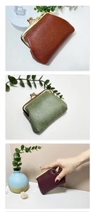 Detailed view of retro leather coin purses in brown, green, and red with metal clasps