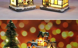 Detail of LED glowing resin Christmas house micro landscape with snow and ice cream sign