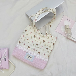 Detailed view of pink heart quilting and bear print on cute cotton tote bag