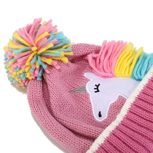 Pink knit unicorn beanie for kids featuring a vibrant rainbow pompom and embroidery