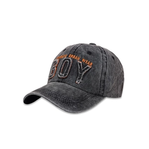 Detail of vintage washed gray baseball cap with 3D BOY embroidery and frayed edges