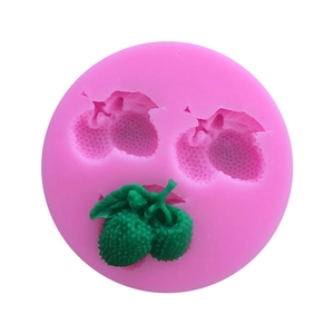 Macro detail of lychee-shaped silicone fondant mold with green finished resin piece