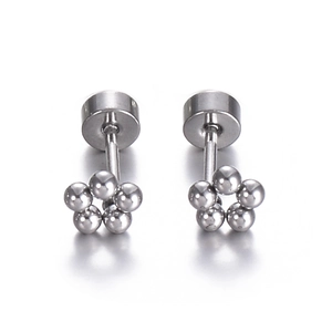 Macro shot of silver titanium steel flower stud earrings with a secure screw-back design