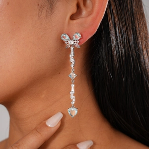 Elegant silver butterfly heart tassel earrings with light blue zircon on female model