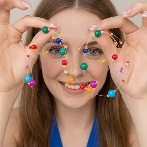Detail of a handmade accessory featuring colorful beads and transparent fishing line