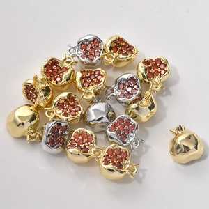 Detail of 14K gold plated pomegranate charms with red zircon for jewelry making