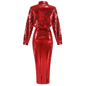Detailed view of red sequin fabric texture on a long sleeve dress with slit
