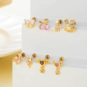 Golden cartilage studs with colorful zircons in heart, bow, and rabbit shapes