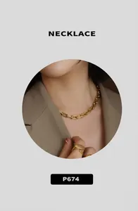 Detailed close-up of a matte gold U-link chain necklace showing vintage texture