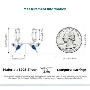 Size chart of hummingbird silver earrings with blue stones next to a quarter coin