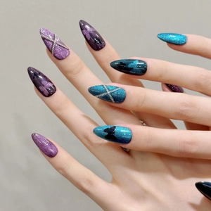 Cat eye press-on nails in blue and purple with black butterfly and silver chains