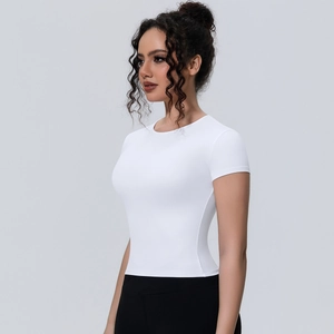 Close-up side view showing slim fit white yoga t-shirt with breathable elastic fabric
