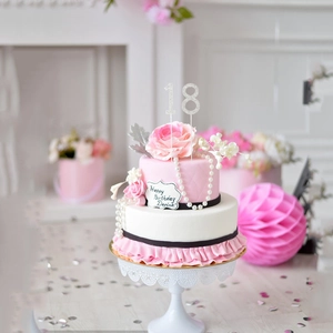 Sparkling silver rhinestone number 18 cake topper on a floral party birthday cake