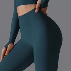 Close-up of seamless dark teal yoga set featuring high waist band and ribbed texture detail