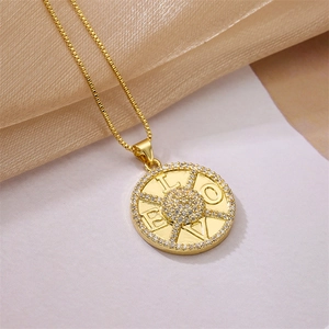 Detail of gold LOVE pendant with sparkling zircons and delicate box chain design