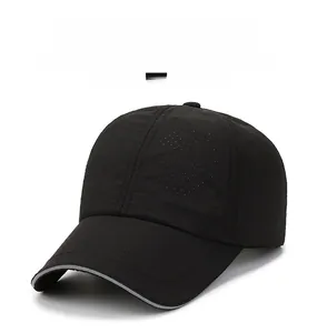 Close-up of black breathable mesh fabric and grey piping on the quick-dry baseball cap