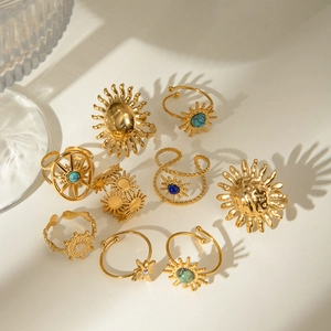 Golden stainless steel celestial rings set with sun motifs and colorful natural stones