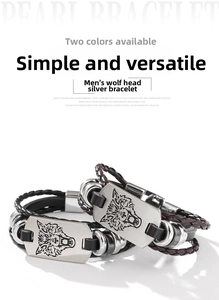 Nahaufnahme von geflochtenem Lederarmband für Herren mit Vintage-Silber-Wolfskopf