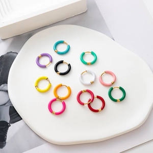 Colorful enamel hoop earrings in 11 shades on white ceramic tray, 18K gold plated steel