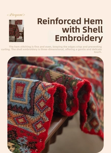 Detail of red jacquard tablecloth with geometric patterns and shell embroidery edge