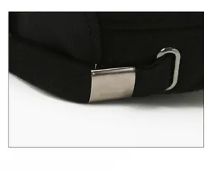 Detail of adjustable metal buckle and black fabric strap on back of the winter cap
