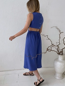 Dark blue sleeveless A-line dress featuring back cutout and button detailing