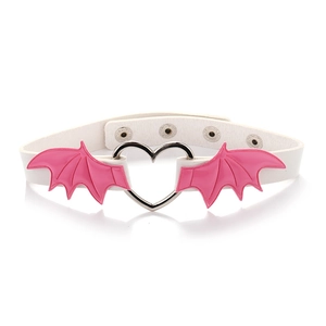 Detail of white leather choker with pink bat wings and silver heart metal ring