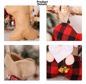 Detail of plaid bone-shaped Christmas stockings with burlap and golden bells