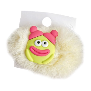 Cute plush hair clip with green cartoon figure wearing a pink hat on yellow base