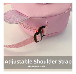 Detail of adjustable shoulder strap buckle on pink PU leather cartoon crossbody bag