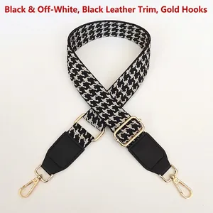 Adjustable houndstooth patterned bag strap with black leather accents and gold hooks