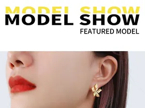 Detailed view of model wearing a 18k gold plated stainless steel floral textured earring