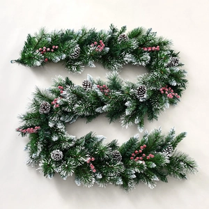 Green PE Christmas garland with red berries, pine cones and white flocked snow