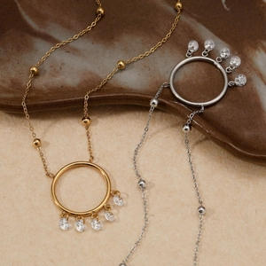 Golden and silver stainless steel dreamcatcher necklace with sparkling zircon pendants