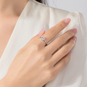 Minimalist S925 sterling silver heart ring with clear cubic zirconia on a model's hand