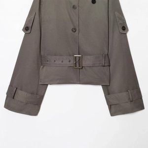 Short double-breasted grey trench coat with classic lapels and adjustable waist belt