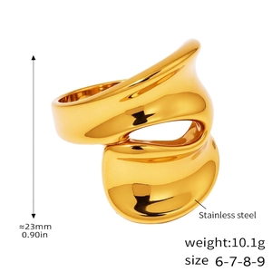 Detailed view of irregular wavy stainless steel ring with 18k gold plating details