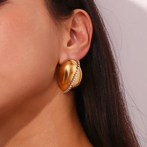 18K gold plated stainless steel oval stud earring with white zircon inlay on model