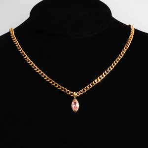 Detail of pink marquise-cut crystal pendant on a gold plated Cuban link chain necklace