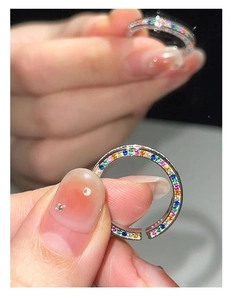 Close-up of S925 sterling silver stamp and colorful zircon inlay on open ring