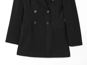 Close-up of double-breasted black blazer jacket featuring notch lapels and dark buttons